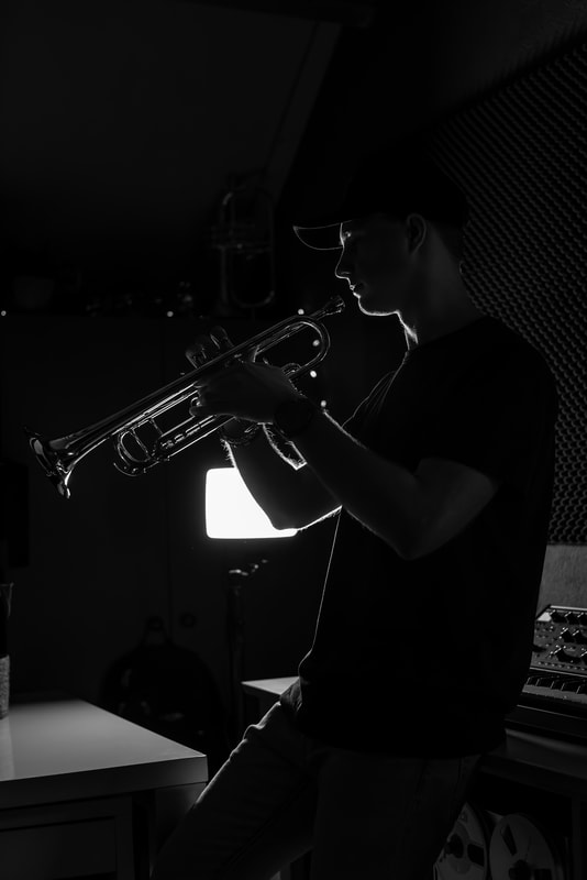 Tim van Werd in studio with trumpet